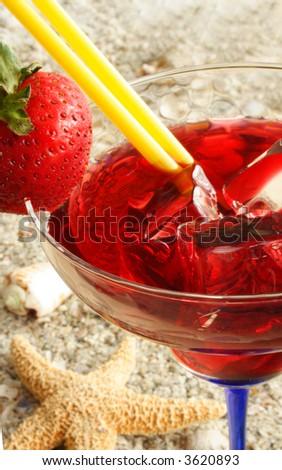 Close up of a red martini and strawberry