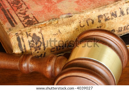 Judge hammer and old legal code