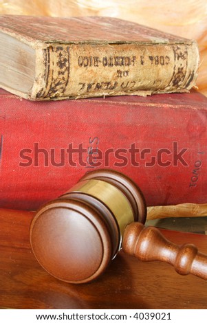 Old law books and judge hammer