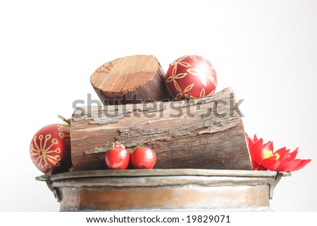 Close up of decorative bunch of logs and red details