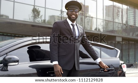 Vip passenger taxi driver politely opening car door for his client, best service