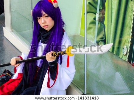 BANGKOK - MARCH 30 : An unidentified Japanese anime cosplay pose in Thai-Japan Anime Music Festival 3 on March 30, 2013 at Central World, Bangkok, Thailand.
