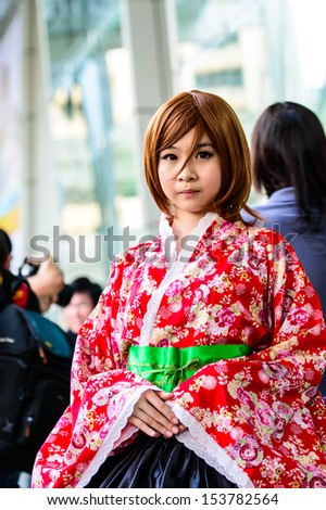 BANGKOK - AUGUST 31 : An unidentified Japanese anime cosplay pose in Japan Festa in Bangkok 2013 on August 31, 2013 at Central World, Bangkok, Thailand.