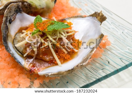 Baked oyster shell spicy sauce with egg shrimp.