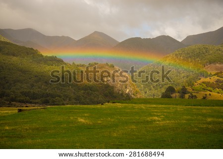 A rainbow after the rain in Arthur\'s Pass, South Island, New Zealand