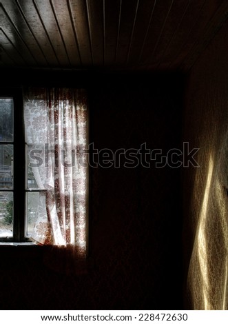 Urban exploration. Autumn day's light on the wall in old, abandoned farm house in Southern Finland.