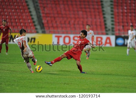  - stock-photo-bangkok-thailand-no-vember-kyi-lin-of-myanmar-r-in-action-during-the-aff-suzuki-cup-120193714