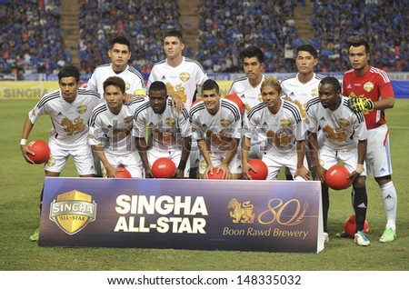 BANGKOK,THAILAND - JULY17: Player of Singha All Star shoot photo during the international friendly match Chelsea FC and Singha Thailand All-Star at the Rajamangala Stadium on July17,2013 in Thailand.