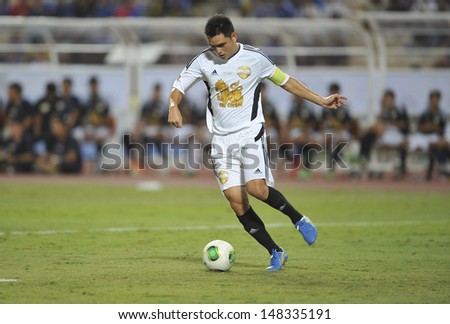 BANGKOK,THAILAND-JULY17:Nattaporn of Singha All-Star in action during the international friendly match Chelsea FC and Singha All-Star at the Rajamangala Stadium on July17,2013 in Thailand.