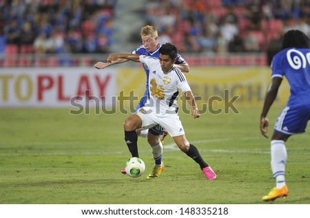 BANGKOK,THAILAND-JULY17:Rnagsan (R2) of Singha All-Star in action during the international friendly match Chelsea FC and Singha All-Star at the Rajamangala Stadium on July17,2013 in Thailand.