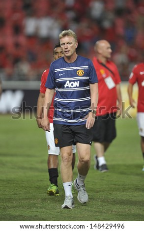BANGKOK,THAILAND-JULY13:Manager David Moyes of Manchester United in action during the friendly match between Singha All Star and Manchester United at Rajamangala Stadium on July13,2013 in Thailand.