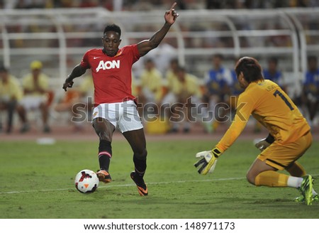 BANGKOK,THAILAND-JULY13: Danny Welbeck(L) of Manchester United in action during the friendly match between Singha All Star and Manchester United at Rajamangala Stadium on July 13, 2013 in Thailand.