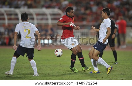 BANGKOK,THAILAND-JULY13: Anderson(L2) of Manchester United in action during the friendly match between Singha All Star and Manchester United at Rajamangala Stadium on July 13, 2013 in Thailand.