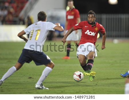 BANGKOK,THAILAND-JULY13: Anderson(R1) of Manchester United in action during the friendly match between Singha All Star and Manchester United at Rajamangala Stadium on July 13, 2013 in Thailand.