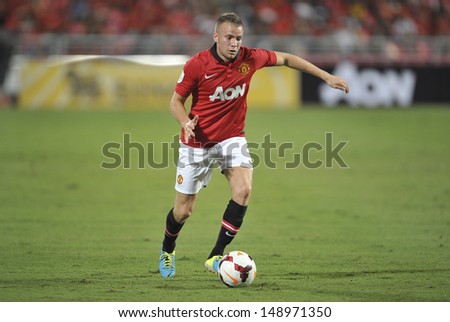 BANGKOK,THAILAND-JULY13: Tom Cleverley of Manchester United in action during the friendly match between Singha All Star and Manchester United at Rajamangala Stadium on July 13, 2013 in Thailand.