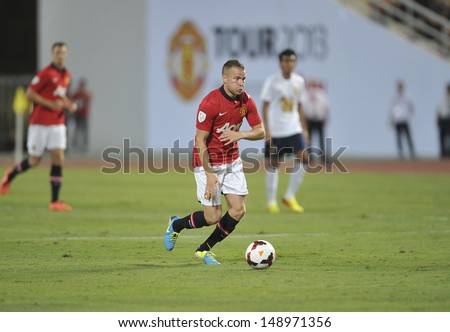 BANGKOK,THAILAND-JULY13: Tom Cleverley(L2)of Manchester United in action during the friendly match between Singha All Star and Manchester United at Rajamangala Stadium on July 13, 2013 in Thailand.