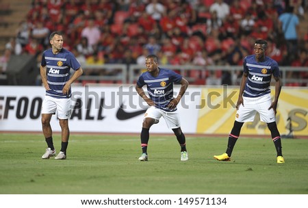 BANGKOK,THAILAND-JULY13: Patrice Evra(L2) of Manchester United in action during the friendly match between Singha All Star and Manchester United at Rajamangala Stadium on July 13, 2013 in Thailand.