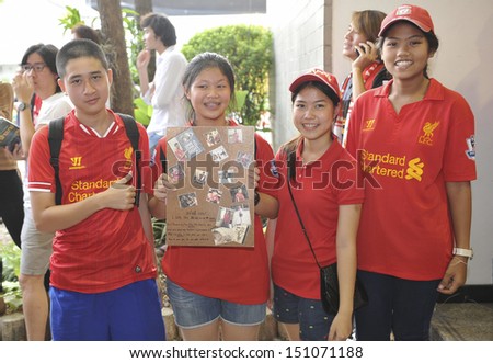 BANGKOK, THAILAND- JULY25, 2013: Fan Club team Liverpool FC with banners cheering came for the team in Liverpool FC at Don Muang airport on July25, 2013 in Bangkok, Thailand.
