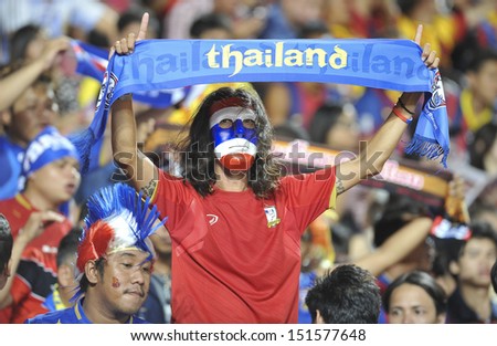 BANGKOK, THAILAND - AUGUST 7: Fans support team Thailand during the international friendly match Thailand XI and FC Barcelona at Rajamangala Stadium on August7,2013 in,Thailand.