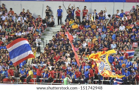 BANGKOK,THAILAND-AUGUST 7:Fans support team Thailand during the international friendly match Thailand XI and FC Barcelona at Rajamangala Stadium on August7,2013 in,Thailand.