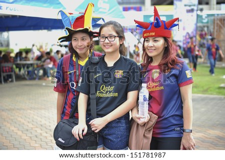 BANGKOK,THAILAND-AUGUST 7:Unidentified supporters during the international friendly match Thailand XI and FC Barcelona at Rajamangala Stadium on August7,2013 in,Thailand.