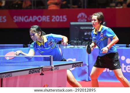 KALLANG,SINGAPORE-JUNE1:Suthasini.S and Nanthana.K of Thailand in action during the 28th SEA Games Singapore 2015 between Thailand and Indonesia at Singapore Indoor Stadium on June1 2015 in SINGAPORE.