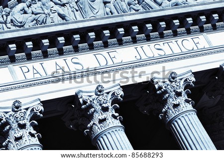 Decorative columns at the facade of an old justice hall building