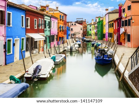 Colorful buildings in Burano island sunny street, Venise, Italy