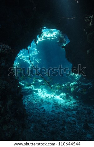 Game of lights inside the cave at Red Sea - underwater landscape