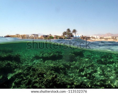 Tropical village above- and under the water, Red Sea, Dahab, half-and-half shot