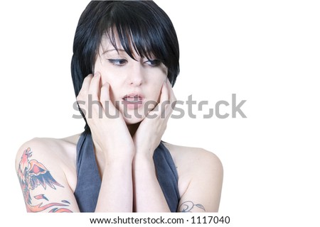 Young trendy woman showing concern with hands on her face