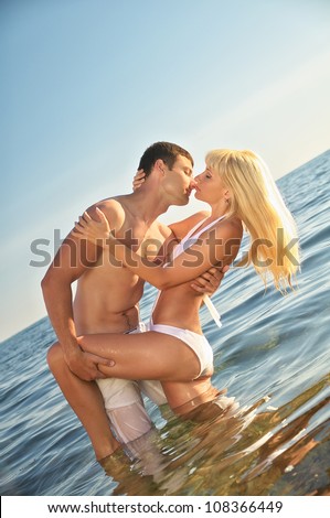 couple kissing in the water
