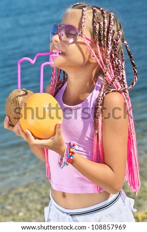 A little girl with fruits of the sea