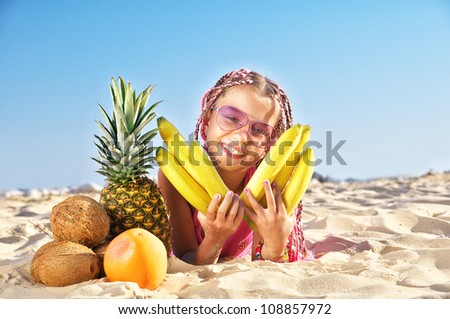 A little girl with fruits of the sea
