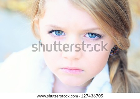 Portrait of a sad, cute girl