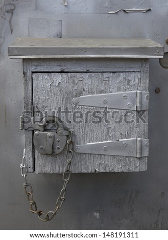 Old mystery wooden box locked with padlock