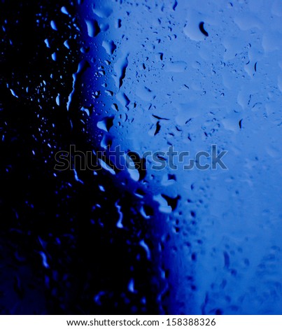 Water drop after raining on dark blue background