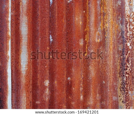 Old rusty damaged piece of metal roofing