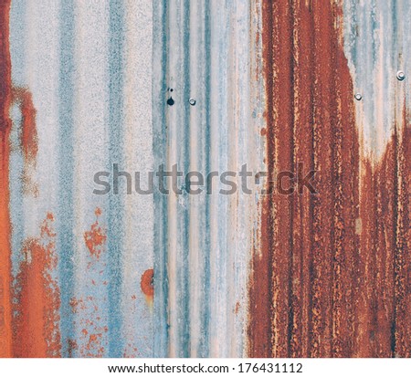 Old rusty damaged piece of metal roofing ,vintage style