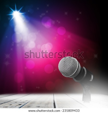 Microphone on wood stage background