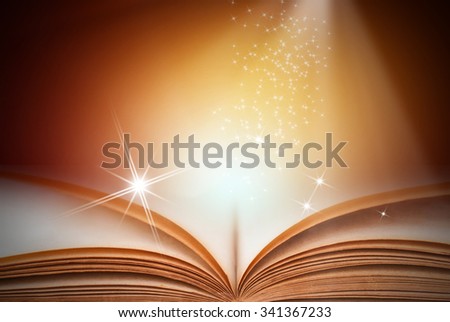 Opened magic book on abstract gold background