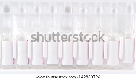 Closed up ampule in plastic tray show medicine concept