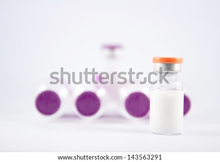 Orange cap vial on blur vials show medicine concept
