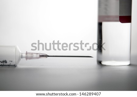 Disposable syringe and injection ampule