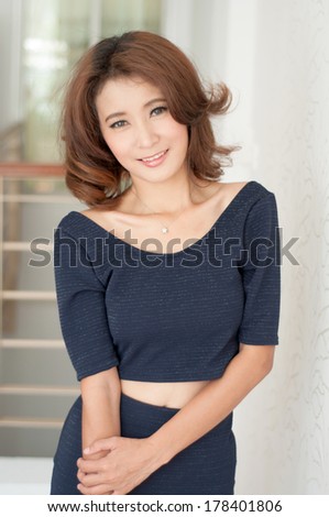 Beautiful asian girl on office background show fashion concept