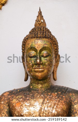 Closed up Old gold buddha statue