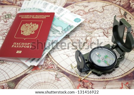 Passport, money and compass. background of the map of the world