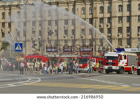VOLGOGRAD - SEPTEMBER 6:Fire engines at the exhibition under the open sky demonstrate the possibility of a fire hose . September 6, 2014 in Volgograd, Russia.