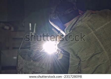 Welder working on welding of shells heat exchanger