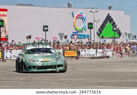 VOLGOGRAD - JUNE 6: Drift car team X-Round enters the bend with slip during demonstrations as part of the tour on cities of Russia \